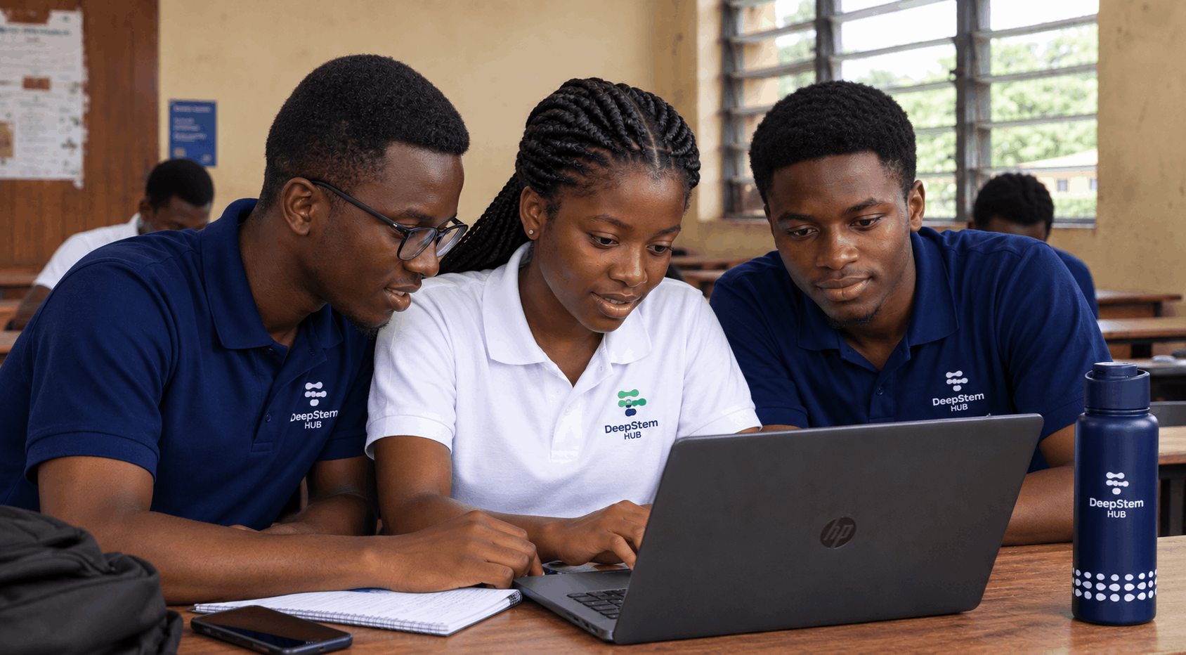 DeepStem Hub university chapter members working together on a laptop